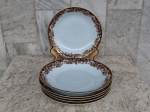 Seis pratos fundos de porcelana Renner de Porto Alegre , design Mon Cheri , branco com bordas floridas no tom ocre e frisos  em ouro brunido. Diâmetro 22 cm.