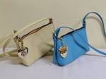 BOLSAS VITOR HUGO (duas ) 1 azul turquesa e outra amarela clara . Originais.