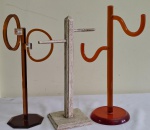 Tres PORTA TOALHAS - dois  em acrílico , tendo um movimento e outro em madeira com pátina . Alturas 40 , 39 e 38 cm.