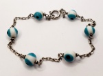 Pulseira produzida em prata de lei, com ornamentação de olho grego, conmprimento aberto:20cm.