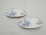 Par de petisqueiras ovais rasas em porcelana portuguesa Vista Alegre. Medindo 17cm x 9,5cm.