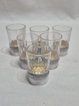 Jogo de 6 copos de shot em cristal com suporte em prata de lei. Medindo 3,5cm x 5cm de altura. Peso em prata 40 gramas.