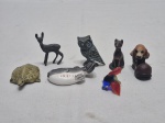 Lote de 7 enfeites na forma de animais em metal, resina, vidro e porcelana. Medindo o maior 4cm de altura.