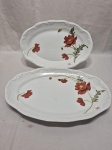 Par de travessas ovais em porcelana Schmidt floral. Medindo a maior 36cm x 24cm.