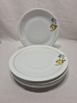 Jogo de 6 pratos rasos de mesa em porcelana Renner flor amarela e friso ouro. Medindo 25cm de diâmetro.