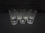 Jogo de 7 copos de suco, água em cristal lapidado. Medindo 6,5cm x 11cm de altura. Peças com manchas internas.