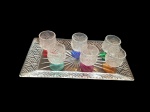 Uma travessa e seis taças para aperitivos em cristal lapidados, bases coloridas, 30 x 15Alt.7,5, Diam. 4 cm.