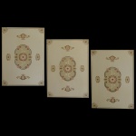 DINUCCI, Salvatore  Conjunto de 3 adornos de porta ou parede. Desenho decorativo sobre pátina bege utilizando elementos naturais e representativos, em dourado antigo. São Paulo. Anos 1950. 95 x 65 cm.