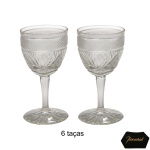 BACCARAT - Conjunto de seis cálices em cristal francês translúcidos. Bojo com lapidação em arabescos e pontilhados. Hastes lisas e aneladas, apoiadas em pés circulares. 9 cm.