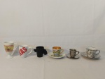 LOTE COMPOSTO POR 6 XÍCARAS DE CAFÉ COLECIONAVEIS DIVERSOS MODELOS EM SENDO 3 COM PIRES, 1 PEDRO II PINTADA À MÃO COM FIO DE CABELO E MARCAS DE USO 5,5 CM D X 4,5 CM DE ALTURA 10,5 CM D, 1 ESCRITO CARRAS 4,5 CM D X 6,5 CM DE ALTURA, 1 COM DETALHE FLORAL NA COR PRATA 6,5 CM D X 5 CM DE ALTURA, PIRES 11 CM S, 1 EM FORMATO DE ARMA NA COR PRETA 4,5 CM D X 5,5 CM DE ALTURA, 1 COM DETALHE DE  PAISAGEM ROMÂNTICA 5,5 CM D X 9 CM DE ALTURA E 1 EM ESTANHO L ESCRITO FL C MG 4 CM D X 4 CM DE ALTURA, PIRES 8 CM D