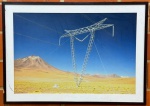QUADRO - Fotografia de torre de transmissão em paisagem desértica. Med. 75x105 cm. Envidraçado e emoldurado - Apresenta vestígio de cupins.