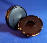 FUJINON - Lente fotográfica profissional eletrônica. MOD. ACM - 18. Não testada, s/ garantia.Mede - Diâmetro do corpo 10 cm.