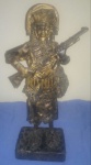 Escultura de papel reciclado, assinatura de artista, Paulo Gomes oriundo de Pernambuco, figura de cangaceiro armado, tamanho base 11cmx9cm altura de 34 cm ,