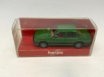 Miniatura de carrinho de maquete Harpa modelo Ford Escort, verde escuro. Na embalagem, mede aproximadamente 2x6 cm.