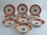 ROYAL BONE FINE CHINA  22kt gold- Dez (10) Saladeiras/bowl em porcelana na cor branca, decorado ao centro com cena galante, borda recortada com faixa bordô com farta douração a ouro em guirlandas. Marcado na base. Med. 3 x 13,5 cm. Apresenta alguns desgastes na douração.