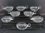 Oito (08) taças para sobremesa em cristal translúcido com alça lateral, lapidação floral. Med. 11,5 cm diâmetro.