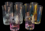 CRISTAL - Lote contendo nove copos no estilo Long Drink, na tonalidade translucido , rose, azul e amarelo.  Sendo três de vidro  e seis de cristal com rica lapidação em relevo.  Med: 14x7 /11x7/14,2x7cm.