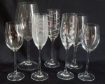 Lote contendo sete taças, confeccionada em demi-cristal no tom translucido de diferentes tamanhos. Sendo três para champangne e quatro para vinho. Med: 28x7,5 / 21x5 /25x5/23,5x8cm.