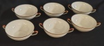 ESCHENBACH - BAVARIA GERMANY  - Belíssimo Conjunto contendo seis consome, confeccionado em  porcelana, com bordas decorada na com frisos dourados.  Med: 15,5x12x4,5cm.