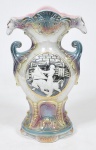 Raul Fernandez, Sevilla España - grande Floreiro circa 1950 em porcelana esmaltada em tons frutais apresentando figuras em relevo com paisagens e cenas de touradas, laterais superiores        representando cabeças de cavalo. Altura 35 cm