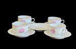 BERNARDAUD LIMOGES  -  conjunto de quatro xícaras com cinco pires de  chá em porcelana Limoges na tonalidade branca com decoração de tulipanacorrosa. Medi:
