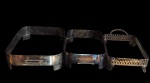 Lote com três suporte  para pirex em metal, sendo um com galeria vazada em arabescos .Med:32x21x7  /28x17,3x7/27x17x6,5cm.