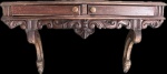Elegante e antigo console de parede, Arte Deco, anos 50, em madeira nobre, ricamente entalhado, com duas gavetas frontais. Med 50x100x32 cm.