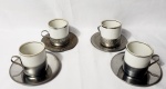 Vera Cruz, Conjunto com 4 xícaras para café produzidas em porcelana, com filetações em prata, suportes produzidos em aço, década de 70.