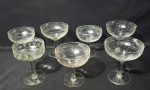 Lote contendo 7 taças produzidas em demi cristal/cristal, linda decoração de frisos, com detalhes charmosos, década de 30, modelo variado, maior comprimento :11cm.