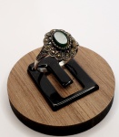 Anel produzido em prata de lei, com ornamentações de pedras marcassitas, e pedra verde, aro:15.