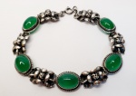 Belíssima pulseira produzida em prata de lei, com ornamentação de Flores e pedra quartzo verde, comprimento aberto:19cm.