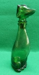 Garrafa de vinho italiano da década de 60 em formato de cachorro, na cor verde. Usado. Sem trincas, lascas ou quebras. 23 A x 6,5 L x 9 C