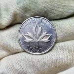 E65 - Moeda Canadá, comemorativa `Série milênio` Harmonia 2000