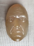 Cabeça de silicone que simula a textura da pele humana para o treinamento de técnicas de preenchimento facial. Dimensões: 8 cm x 15 cm x 24 cm