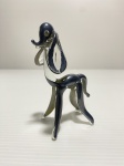Miniatura de cachorro de vidro  com detalhes revestidos de prata 925. Dimensões: 9,5 cm.