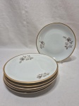 Jogo de 6 pratos de sobremesa em porcelana Renner floral com friso ouro. Medindo 18cm de diâmetro.