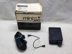 Flash eletrônico Mini Frata 380 com cabos e caixa