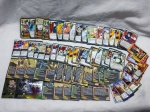 Lote com aproximadamente 50 cartinhas e cards do naruto