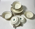 ROSENTHAL- Conjunto de seis consumê em fina porcelana alemã, na tonalidade bege com friso prateado. Medidas: 6 x 12 cm