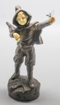 ESCULTURA - Georges Omerth (1895-1925) - Estatueta em bronze e marfim, início do Século XX, representando menino com estilingue. Assinada. 17 cm.