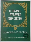 O Brasil Através dos Selos  Heroísmo e Glória (Edição 3) Terceiro fascículo da série da Bloch Editores que retrata momentos e personagens marcantes da história brasileira, exaltando feitos heroicos e conquistas memoráveis através da arte dos selos postais. Uma verdadeira viagem visual pelo patriotismo e pela bravura nacional.