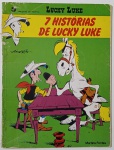 Lucky Luke: 7 Histórias de Lucky Luke Uma coletânea divertida publicada pela Martins Fontes, com sete aventuras do pistoleiro mais rápido do Oeste  Lucky Luke! Criado por Morris, o personagem enfrenta desafios com seu inseparável cavalo Jolly Jumper, como mostra a capa bem-humorada em que os dois disputam uma queda de braço. Com o selo da Dargaud, esta edição promete humor, ação e o charme clássico dos quadrinhos franco-belgas.