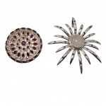 Dois pedantifes em prata um deles com ponteiras ornamentadas com pedras azuis e um circular com rubiblitas, falta uma pedrinha azul,  Diam. 9 e 5 cm. 70,8 g.