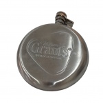 Garrafa de bolso em alumínio com logo da Grants, Diam. 12 cm.