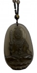Longo colar feito com esferas e grande pendente lapidado no feitio de Buda em quartzo fume. Comprimento: 38,5cm