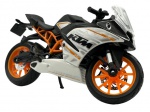 Colecionismo - Moto KTM modelo RC 390 em metal com partes em material sintético. Suspensão com mola traseira. Guidão e tripé ativos. Marca: Maisto Escala 1:18 Altura: 6cm Comprimento: 11cm Largura: 4,2cm