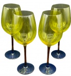 Quatro taças em cristal europeu em tons de degradê amarelo, laranja, vermelho e azul. Altura: 25cm