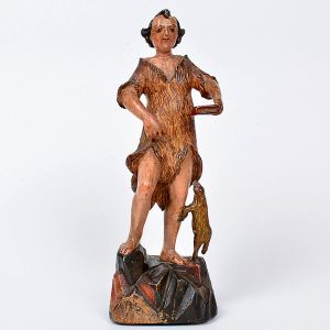 Bela imagem de <b>São João Batista </b>em madeira entalhada, apresentando bela postura e policromia preservada. Túnica em pele. À mão esquerda apresenta a bíblia e aos pés o Cordeiro de Deus. Realces a ouro. Início do séc. XIX. Alt. 25,5 cm