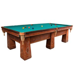 <b>Mesa de sinuca</b>  Brunswick em madeira nobre com decoração geométrica em "marqueterie". Caçapas em cordão com franjas e tampo revestido em feltro verde. Acompanha conjunto de bolas. Meados do séc. XX. Med. 84 x 280 x 152 cm