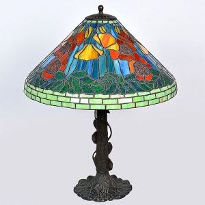 <b>Luminária de mesa </b>estilo Tiffany, com cúpula em vitral policromado de motivos florais e base em metal trabalhado com folhas e flores em relevo.  Alt. 65 cm; Diâm. 54 cm